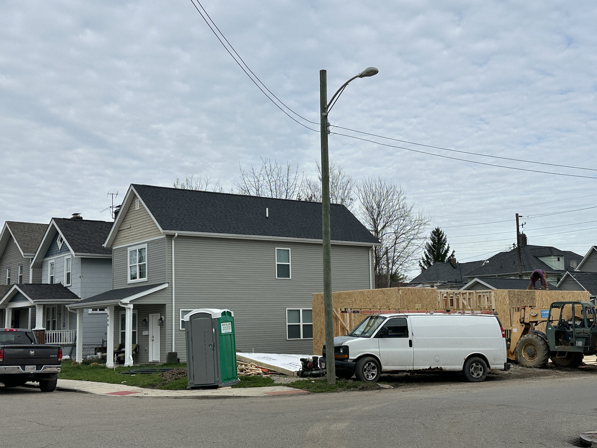 Completed WJ3 Singles home with grey siding and front porch
